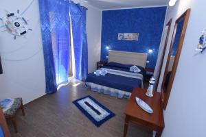 Postel nebo postele na pokoji v ubytování B&B Empedocle