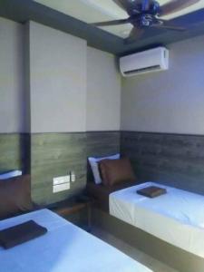 Llit o llits en una habitació de Qing Yun Resthouse -Delima Satu