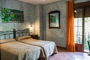 Łóżko lub łóżka w pokoju w obiekcie Aparthotel Rural 12 Caños