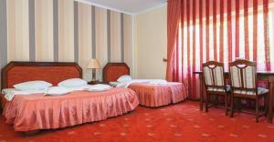 Postel nebo postele na pokoji v ubytování Hotel Premier + 37 fotografií