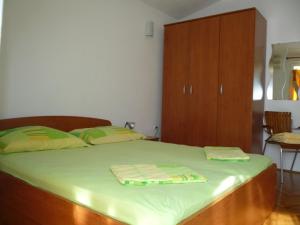 Postel nebo postele na pokoji v ubytování Apartmani Meri