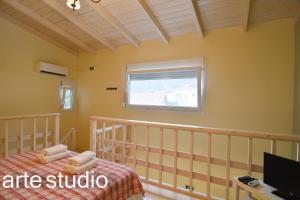 A television and/or entertainment centre at Suites Pierion Musses