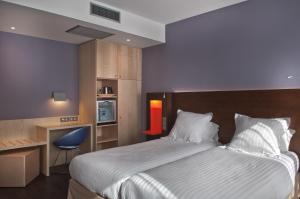 Postel nebo postele na pokoji v ubytování Best Western Seine West Hotel