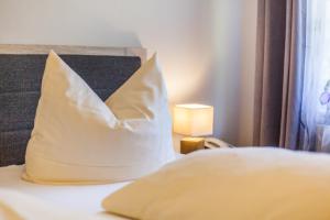 Ein Bett oder Betten in einem Zimmer der Unterkunft Sporthotel Wernigerode