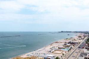 an aerial view of a beach with a crowd of people at Hotel Riviera in Mamaia