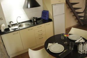 Kuchyňa alebo kuchynka v ubytovaní Urbi Apartments