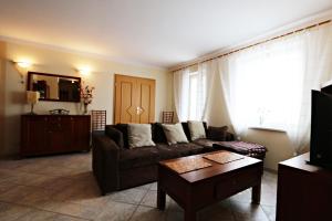 Televízia a/alebo spoločenská miestnosť v ubytovaní Neptun by Baltic Home