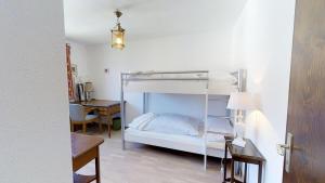 Двухъярусная кровать или двухъярусные кровати в номере Collina