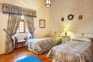 a bedroom with two beds and a window at Casa D Obidos in Óbidos +73 photos