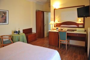 Postel nebo postele na pokoji v ubytování Hotel Benessere Villa Fiorita
