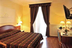 Postel nebo postele na pokoji v ubytování Hotel Benessere Villa Fiorita