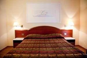 Postel nebo postele na pokoji v ubytování Hotel Benessere Villa Fiorita