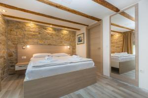 Postel nebo postele na pokoji v ubytování Minella Residence