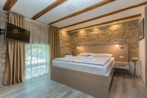 Postel nebo postele na pokoji v ubytování Minella Residence
