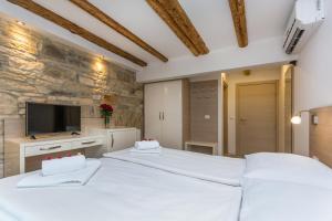 Postel nebo postele na pokoji v ubytování Minella Residence