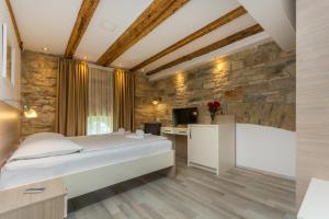 Postel nebo postele na pokoji v ubytování Minella Residence