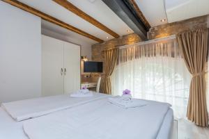 Postel nebo postele na pokoji v ubytování Minella Residence
