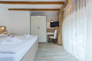 Postel nebo postele na pokoji v ubytování Minella Residence