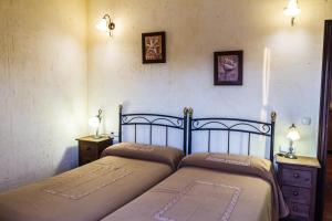 Łóżko lub łóżka w pokoju w obiekcie Aparthotel Rural 12 Caños