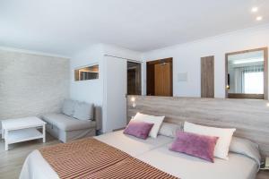 Postel nebo postele na pokoji v ubytování Hotel Na Taconera