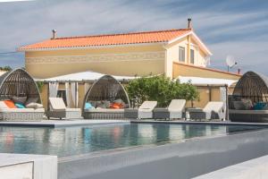 a villa with a swimming pool and a house at The Fig Boutique Suites in Salir de Porto