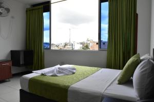 Voodi või voodid majutusasutuse Hotel El Principe Sede Campestre toas