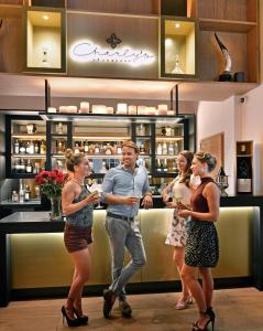 a group of people standing in front of a bar at Boutique Hotel Steenhof Suites in Leiden