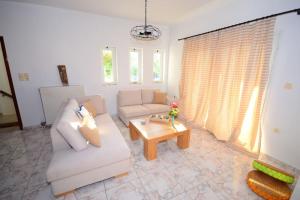 A seating area at Christina Apartment