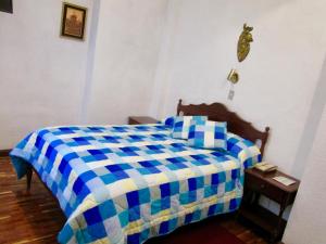 Postel nebo postele na pokoji v ubytování Hotel Huasi Continental