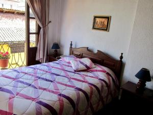 Postel nebo postele na pokoji v ubytování Hotel Huasi Continental