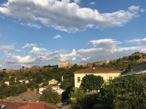 a view of a town with a castle on a hill at Ahmetaj Guest House in Gjirokastër