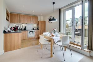 a kitchen and dining room with a table and chairs at The Class Place in Birmingham