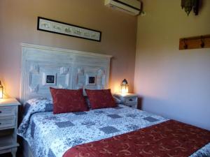 En eller flere senge i et værelse på Guidai Bilu