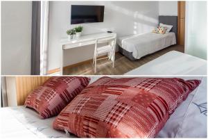 a hotel room with a bed and a desk at Furabeach Alojamentos in Furadouro