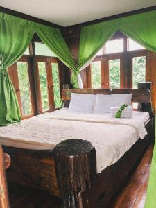 Postel nebo postele na pokoji v ubytování Sukhothai City Resort