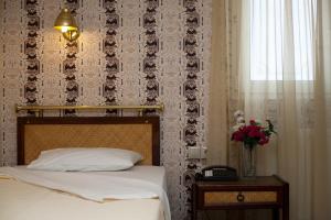 Posteľ alebo postele v izbe v ubytovaní Olympos Hotel