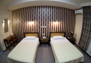 Posteľ alebo postele v izbe v ubytovaní Olympos Hotel