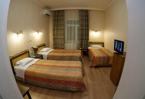 Posteľ alebo postele v izbe v ubytovaní Olympos Hotel