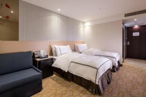 Postel nebo postele na pokoji v ubytování K Hotel Tianjin