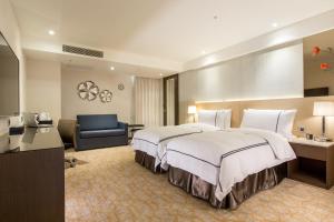 Postel nebo postele na pokoji v ubytování K Hotel Tianjin