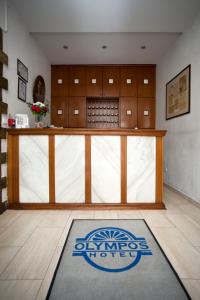 a large room with a large entry door to a gym at Olympos Hotel in Komotini