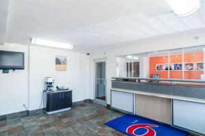 a large room with a kitchen with a counter at Motel 6-Oklahoma City, OK - South in Oklahoma City