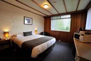 Postel nebo postele na pokoji v ubytování Silver Hills Motel
