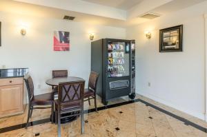 a dining room with a table and a refrigerator at Motel 6-Lexington, VA in Lexington