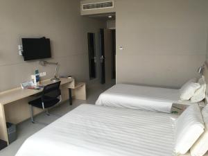 TV a/nebo společenská místnost v ubytování Jinjiang Inn Fuzhou Cangshan Olympic Centre