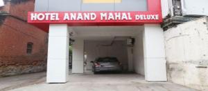 a garage with a car parked under a hotel manual clause at Anand Mahal Hotel in Nagpur