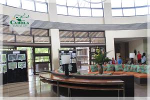 a lobby of a shopping mall with a couch in it at CAROLA in Pico de Loro in Nasugbu