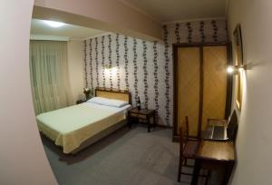 Posteľ alebo postele v izbe v ubytovaní Olympos Hotel