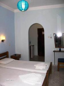 Кровать или кровати в номере Atlantis Hotel