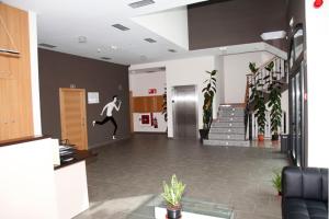 a lobby with a person on a sign on the wall at Hotel Restaurante Zelaa in Zaldivia